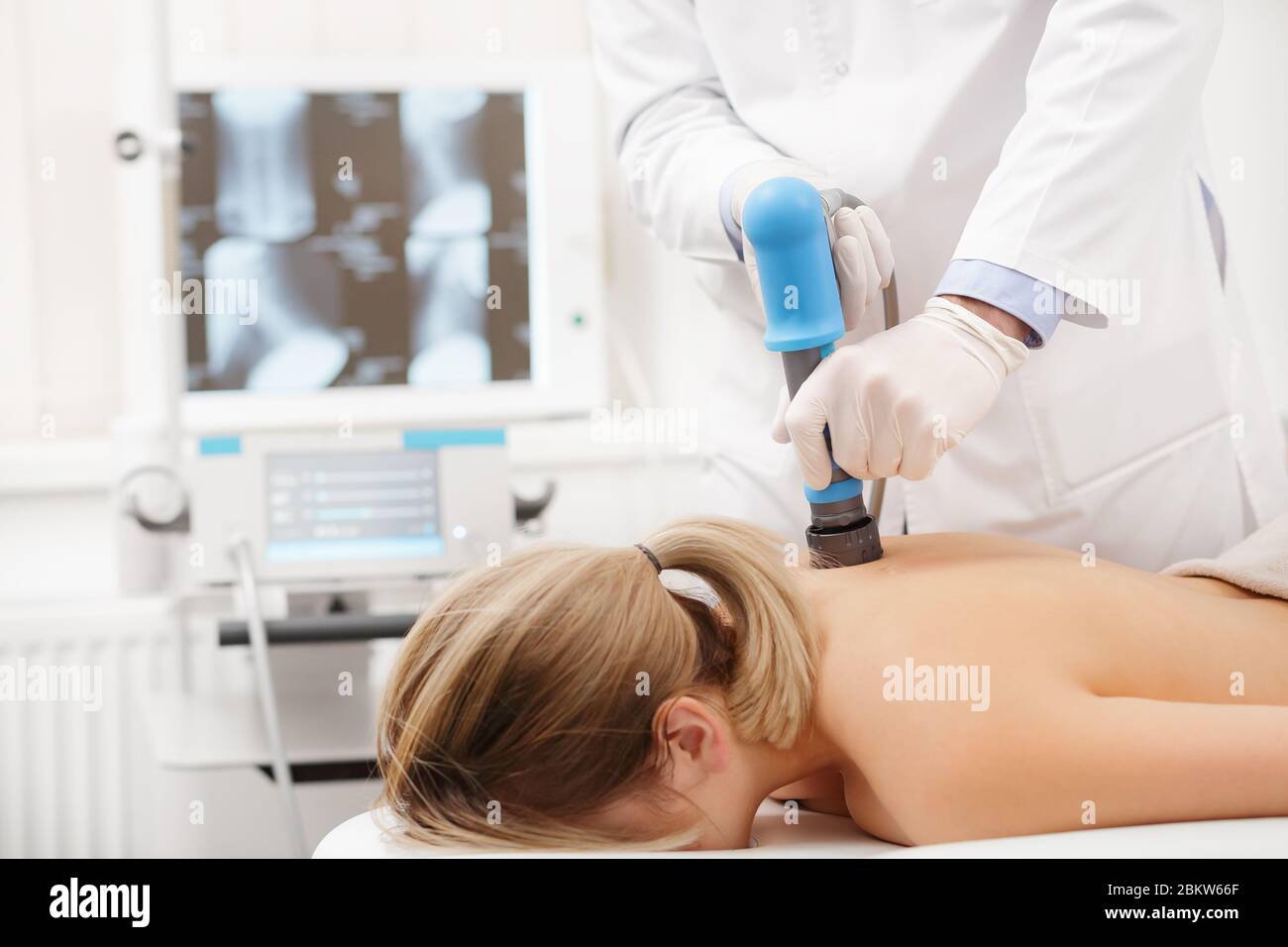https://c8.alamy.com/comp/2BKW66F/extracorporeal-shockwave-therapy-eswtnon-surgical-treatmentphysical-therapy-for-neck-and-back-musclesspine-with-shock-wavespain-relief-2BKW66F.jpg