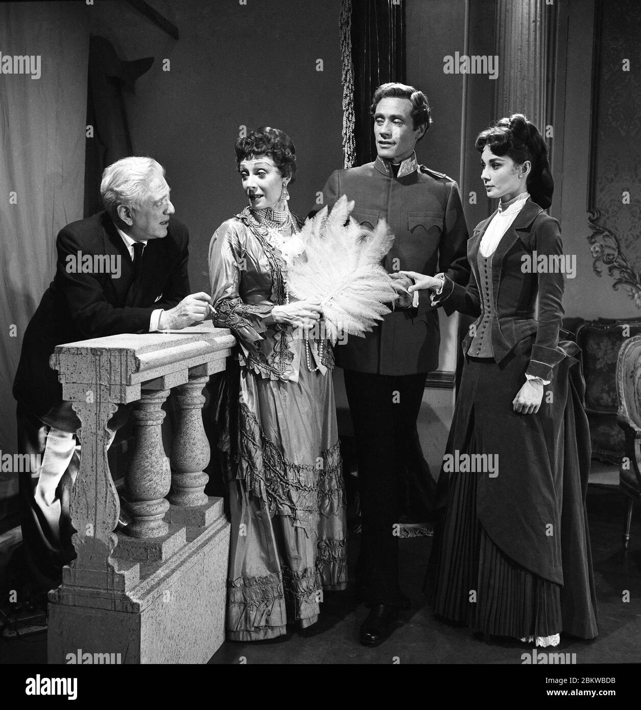 Director ANATOLE LITVAK JUDITH EVELYN as Countess Larische MEL FERRER as Crown Prince Rudolph and AUDREY HEPBURN as Marie Vetsera on set candid during filming of MAYERLING 1957 Season 3 Episode 6 of Producer's Showcase Showcase Productions / National Broadcasting Corporation (NBC) Stock Photo