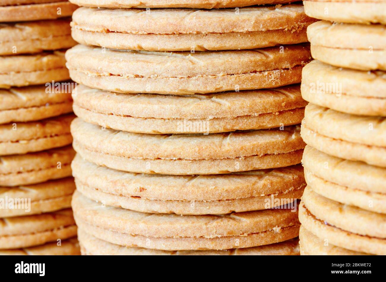 Stacks of typical dutch Syrup Cookies (stroopkoeken) a variant of the famous Gouda syrup waffle (stroopwafels). Shallow depth of field. Stock Photo