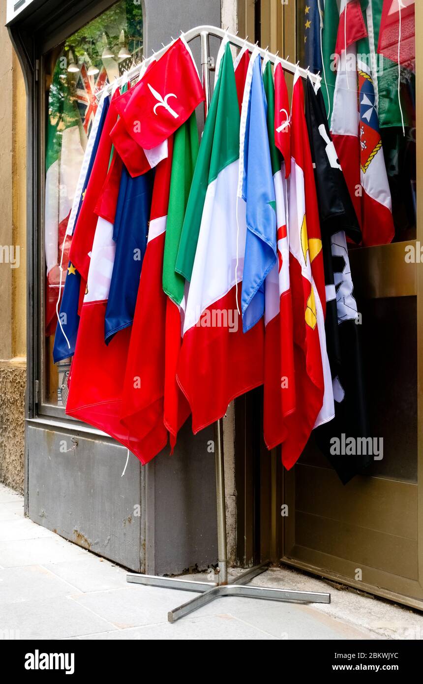 Many flags on display for sale, outside a store. Shopping. Close up, detail. Stock Photo