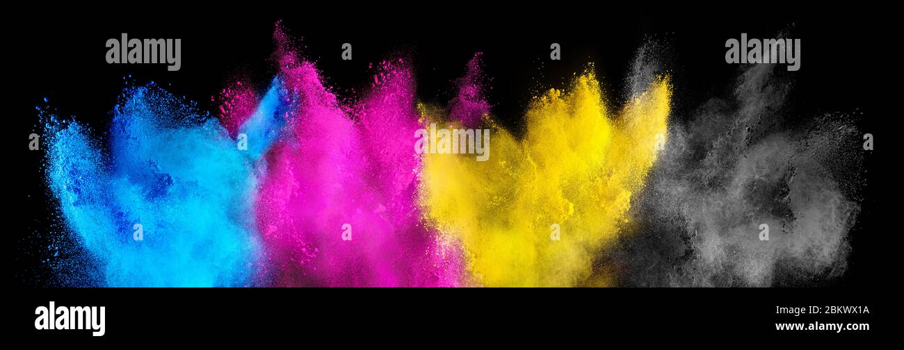 colorful CMYK cyan magenta yellow key holi paint color powder explosion isolated on dark black background. printing print business industry manufactur Stock Photo