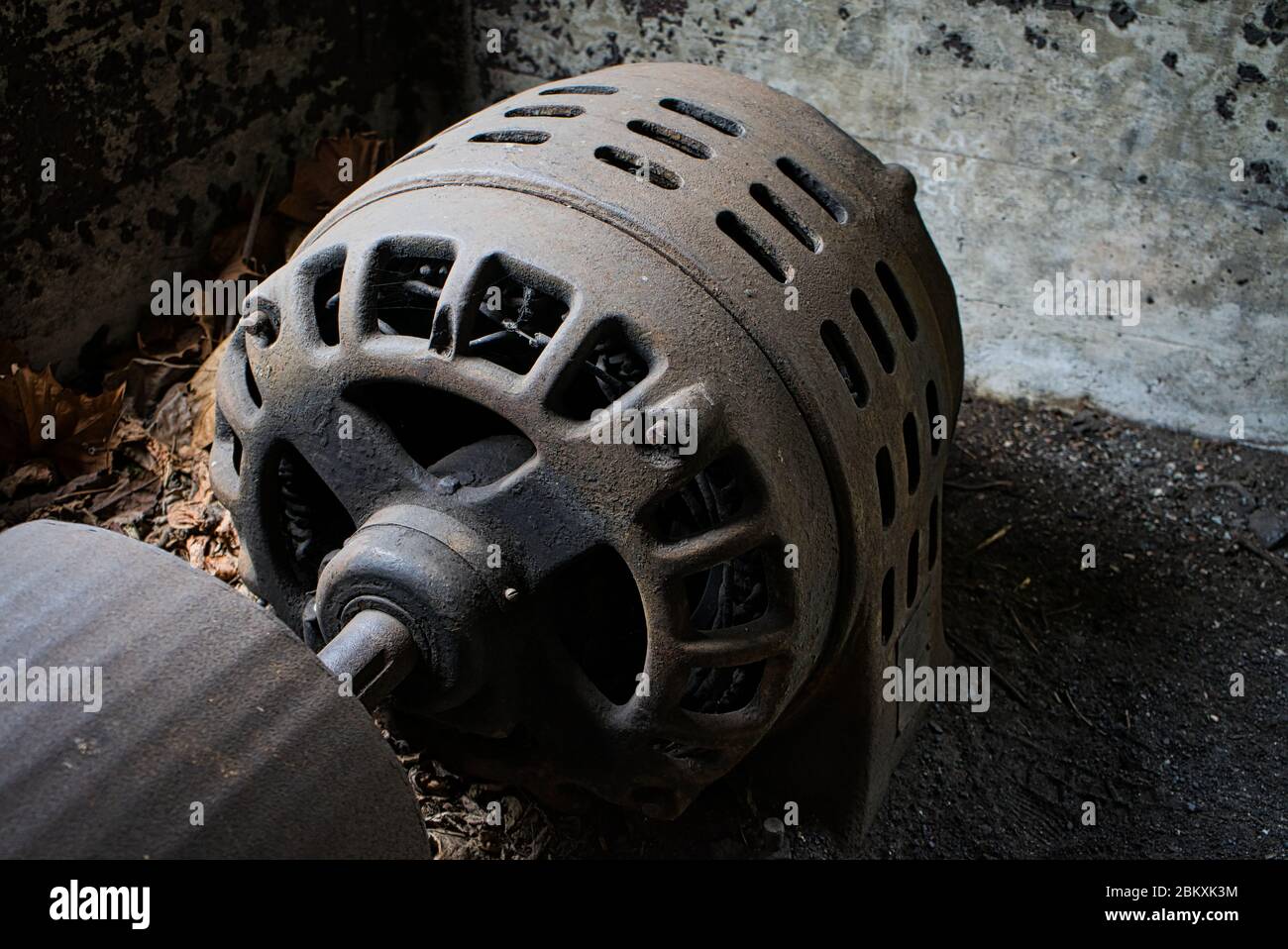 Large electric motor located in abandoned building Stock Photo