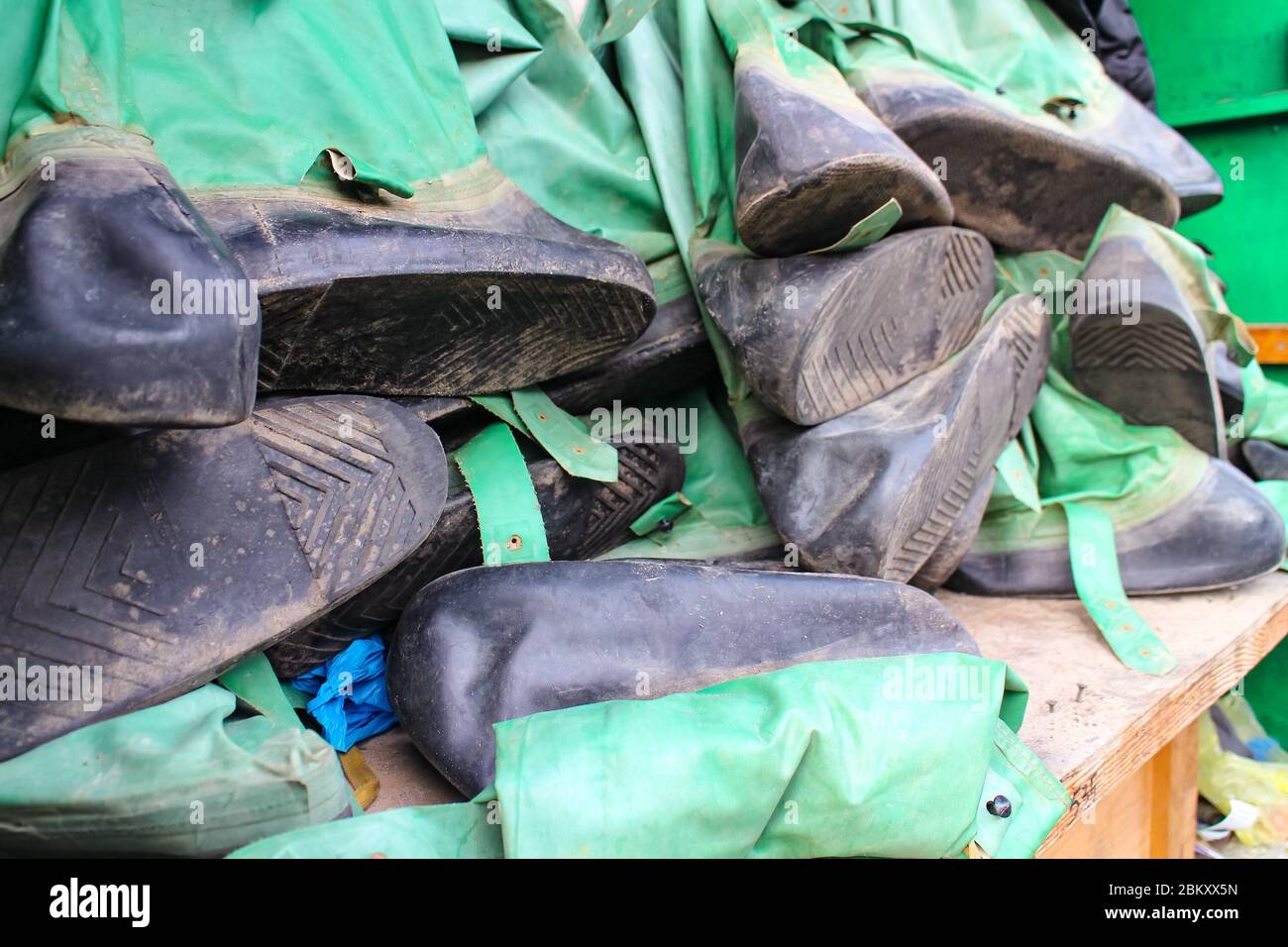 Stash of heavy rubber protective boots, a similar kind as used by the Chernobyl liquidators, seen in Kiev, capital of Ukraine. Stock Photo