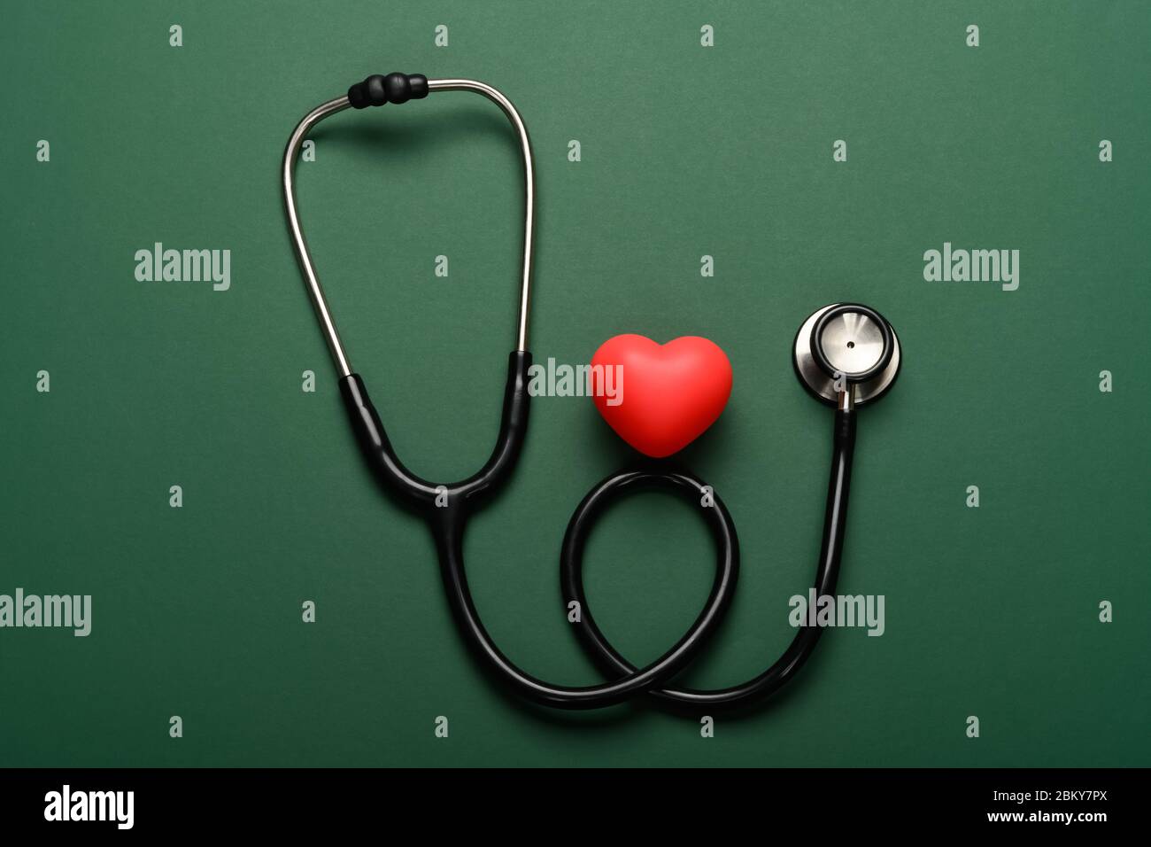 heart and stethoscope on a green background Stock Photo - Alamy