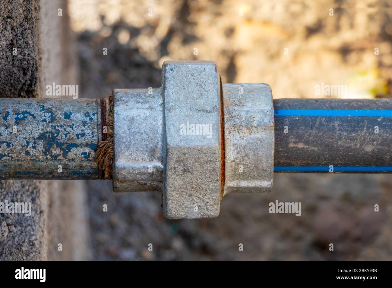 Pipe Union, Joint of plastic (PVC) and Steel pipe, close-up Stock Photo
