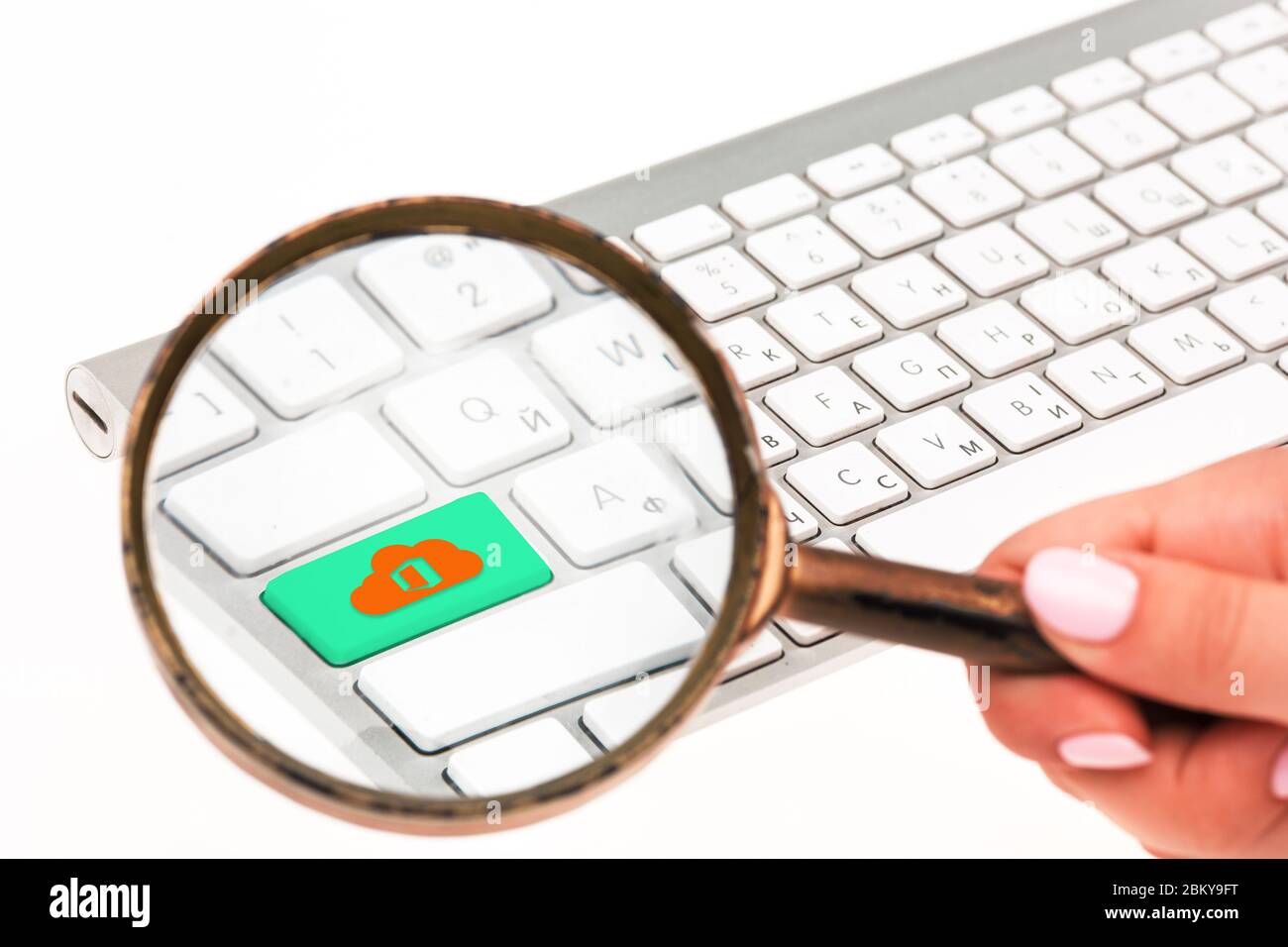 The keyboard of laptop with a magnifying glass Stock Photo - Alamy
