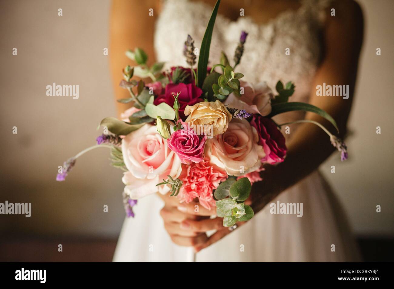 mexican Wedding bouquet of flowers in the hands of the bride in mexico