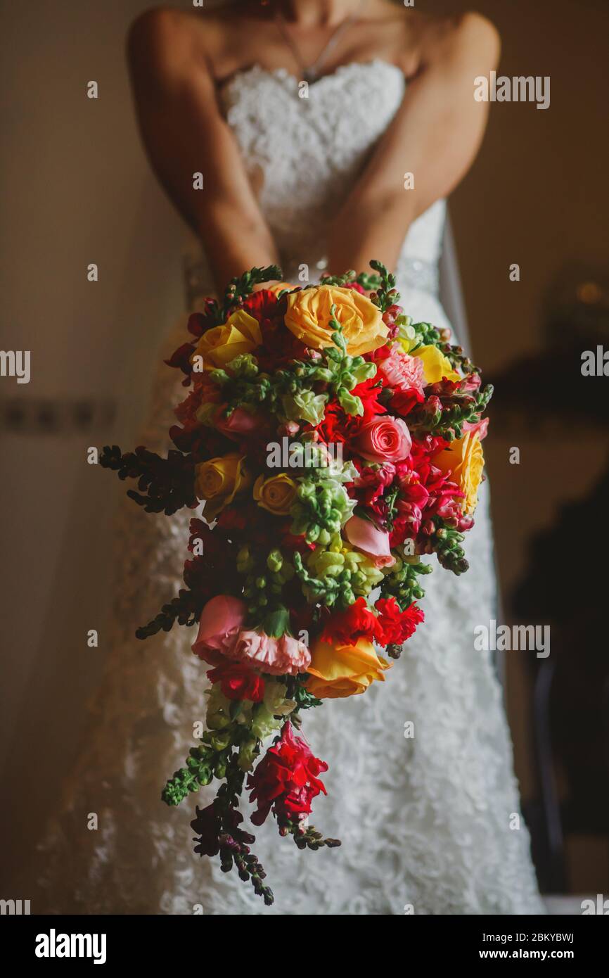 mexican Wedding bouquet of flowers in the hands of the bride in mexico