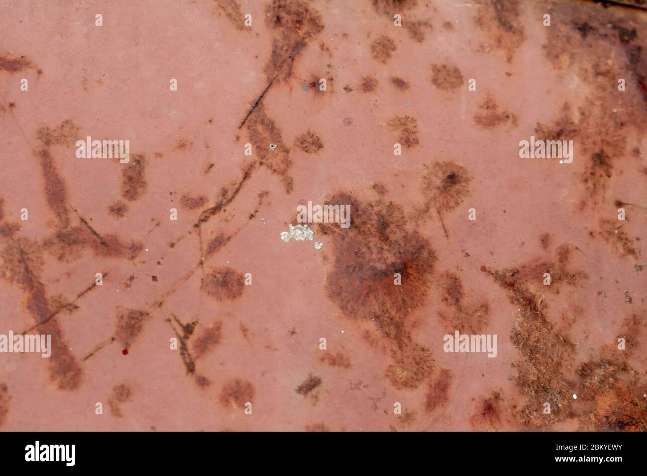 Bright rust stains texture paint showing through to rust underneath