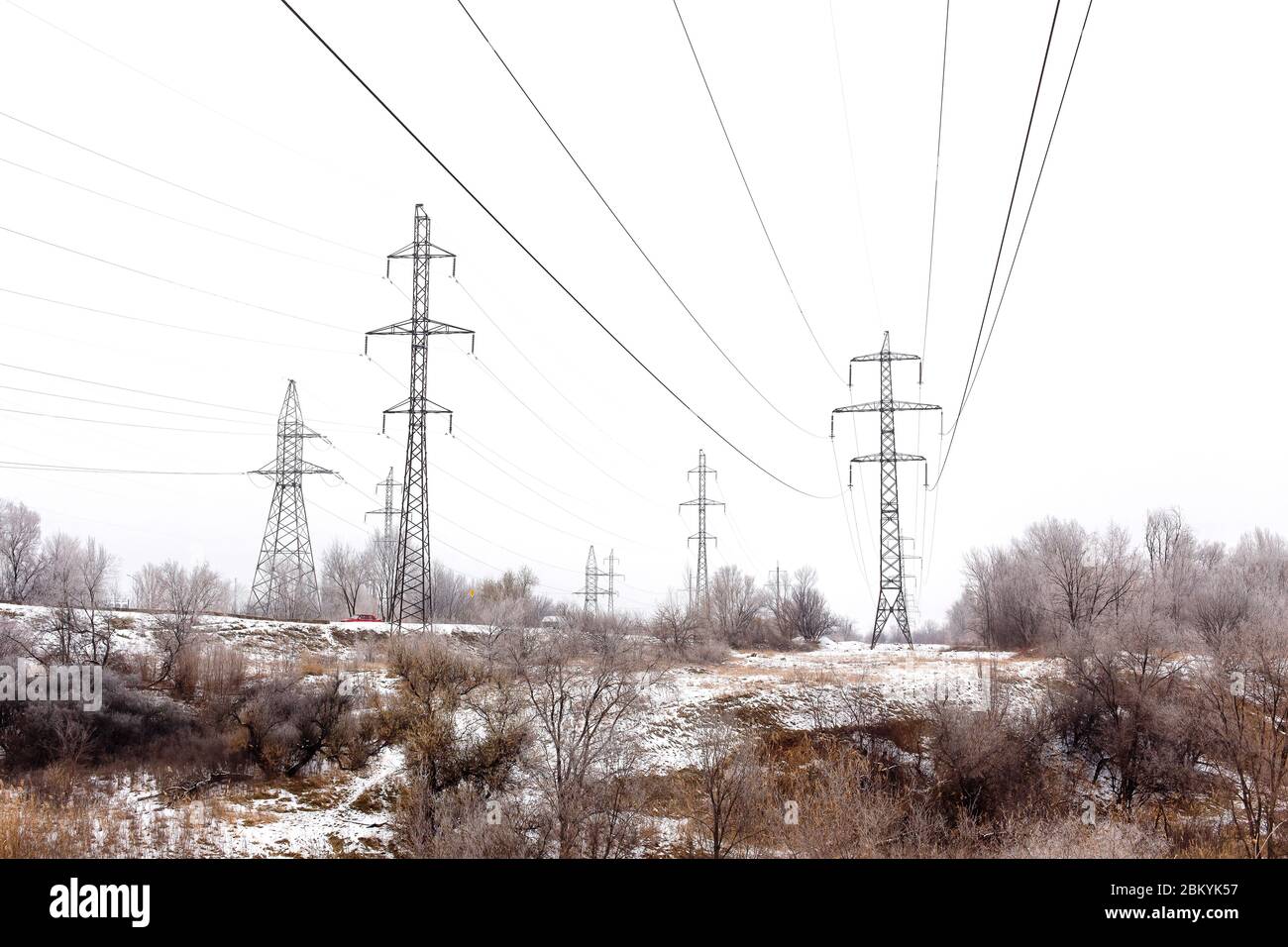 Supports high-voltage power lines in winter Stock Photo - Alamy