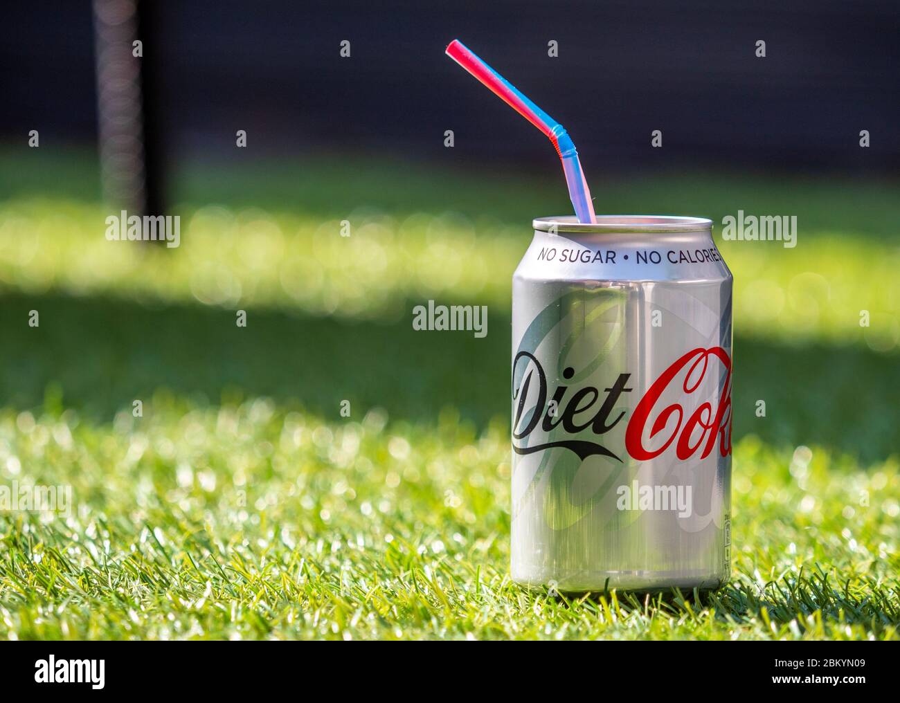 Open Can of Diet Coke with Plastic Straw, Diet Coke is made by The Coca-Cola Company and was first introduced in 1982 Stock Photo