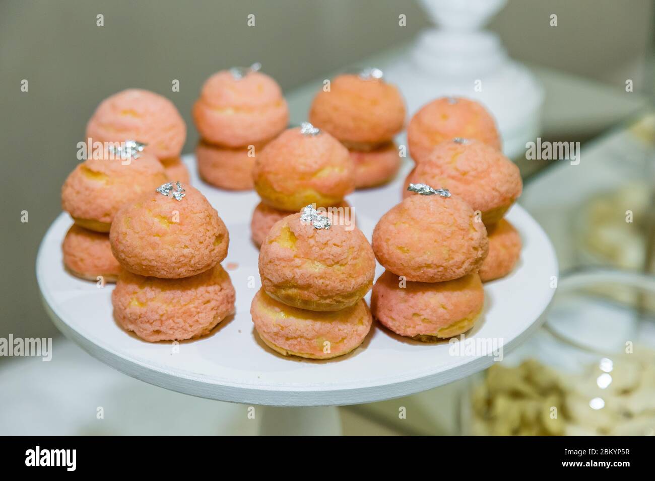 Fresh sweets on the festive table in the restaurant. Stock Photo