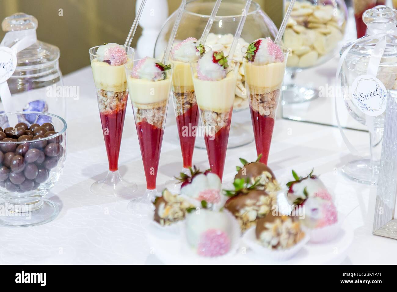 Fresh sweets on the festive table in the restaurant. Stock Photo