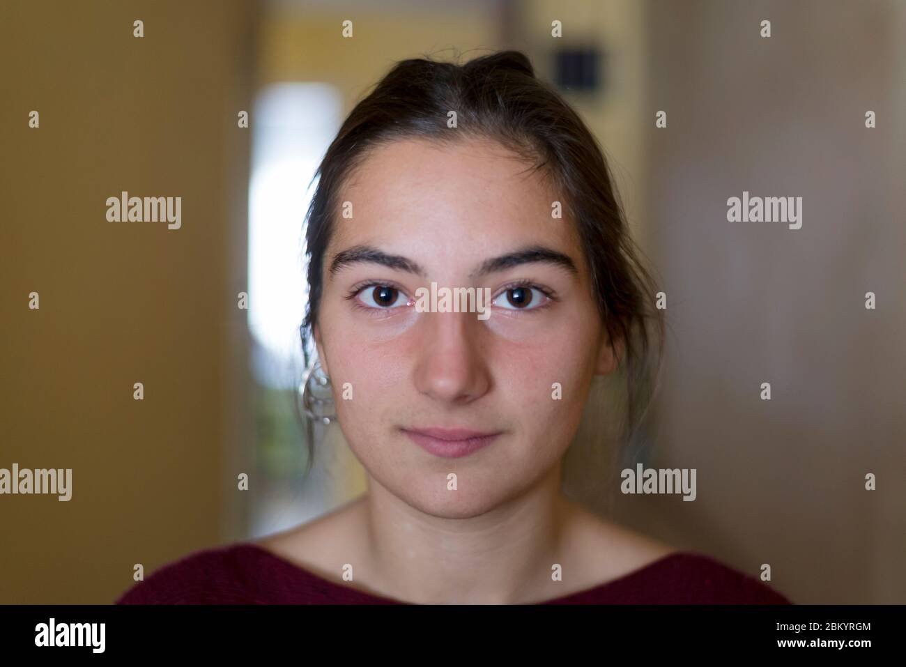 Closeup portrait of a young woman looking camera Stock Photo - Alamy