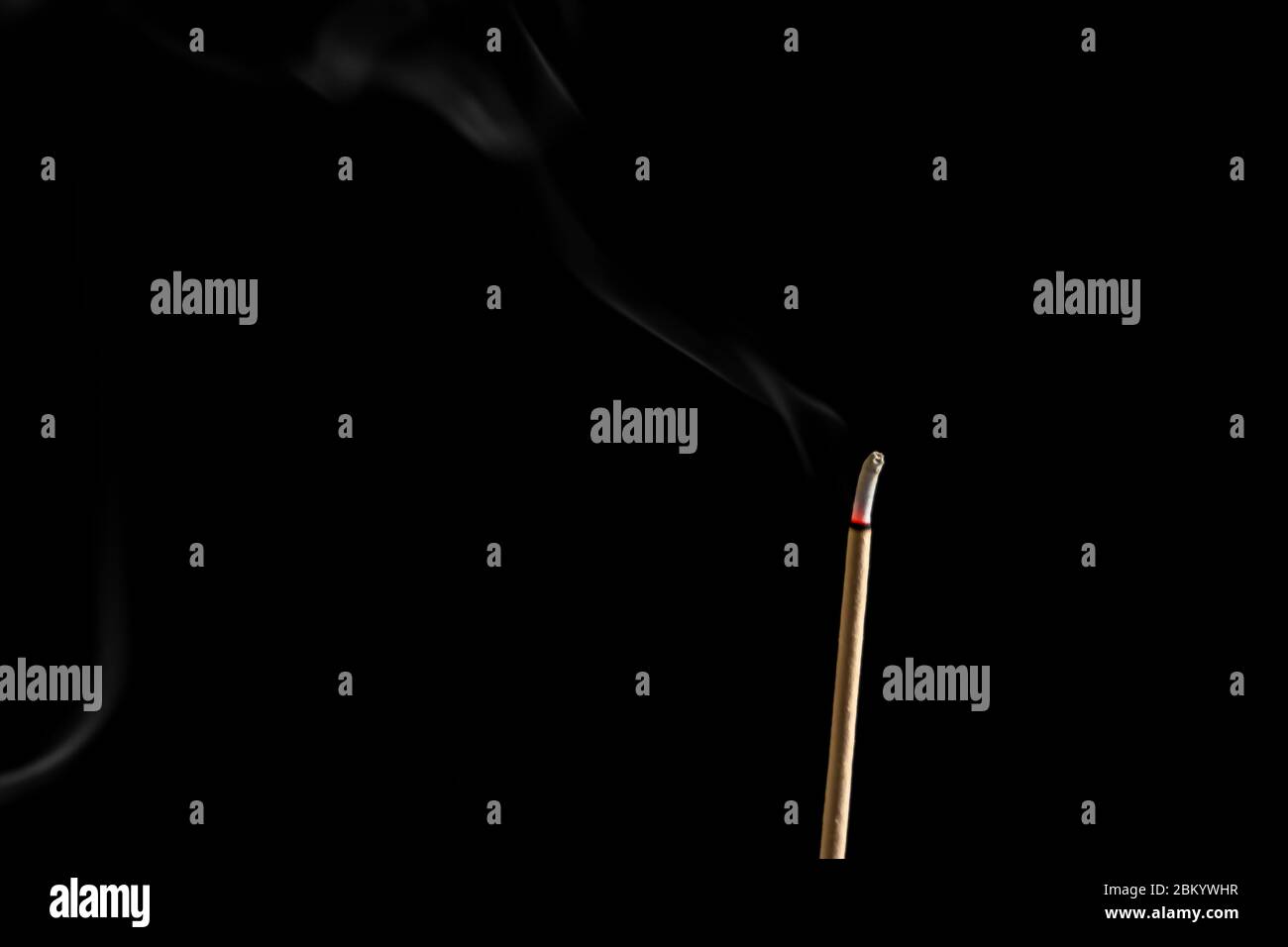 Incense sticks and incense stick smoke on black backgrond with white backlit Stock Photo