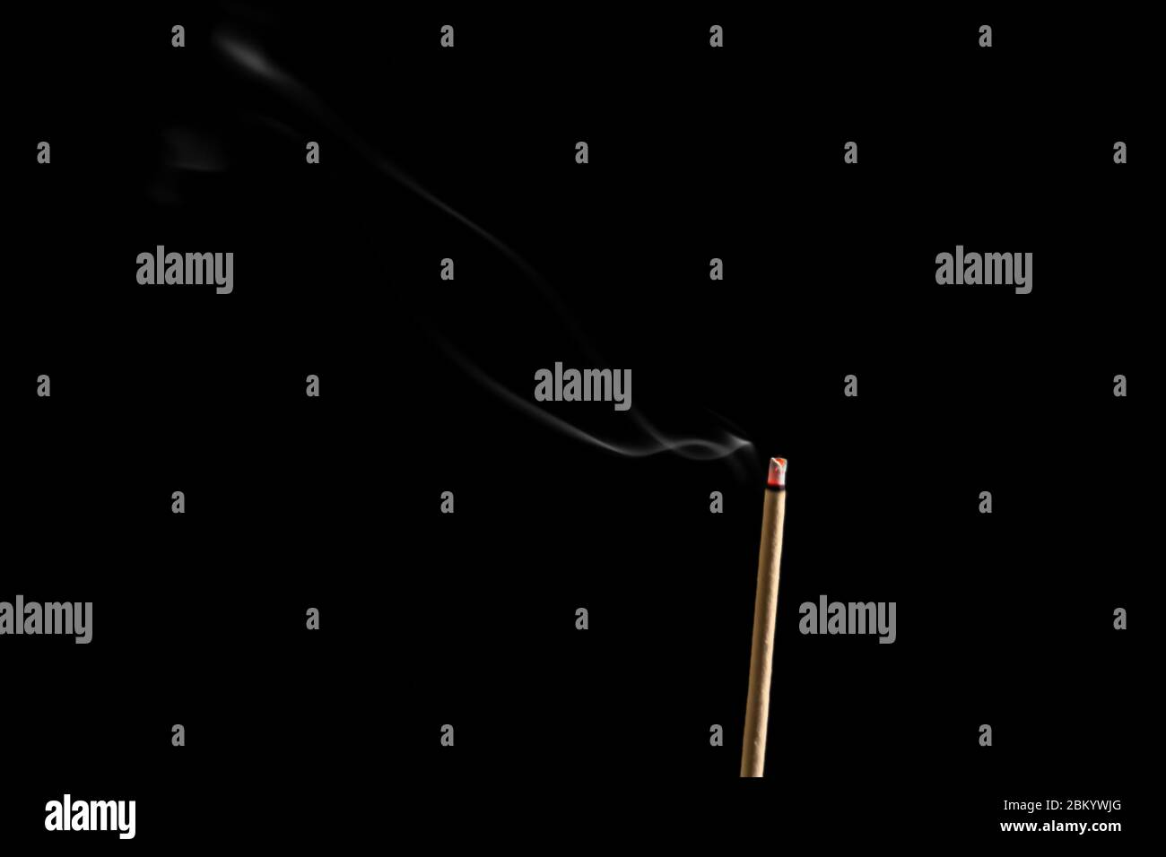 Incense sticks and incense stick smoke on black backgrond with white