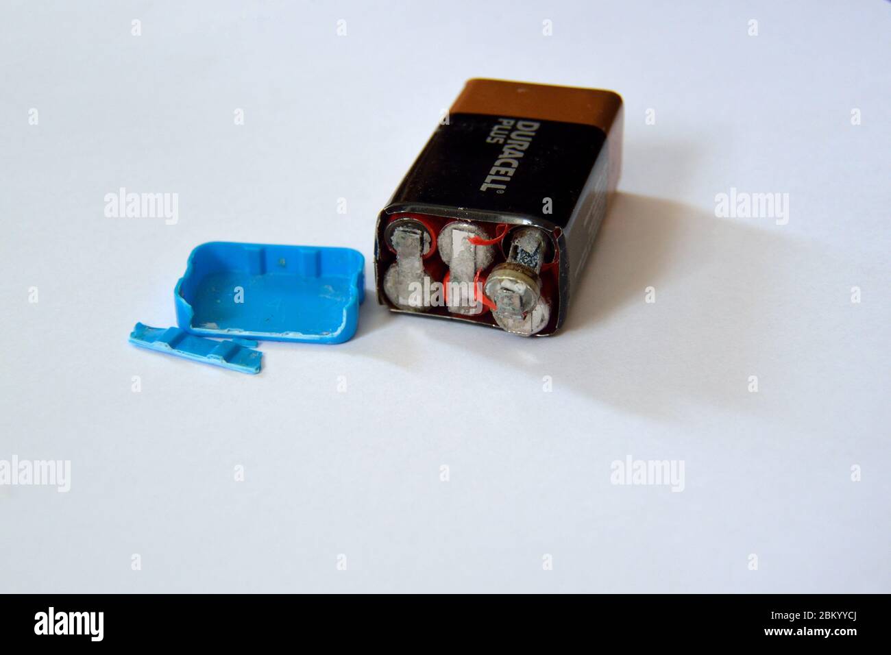 Old Duracell PP3 9 volt battery after having burst open due to failure