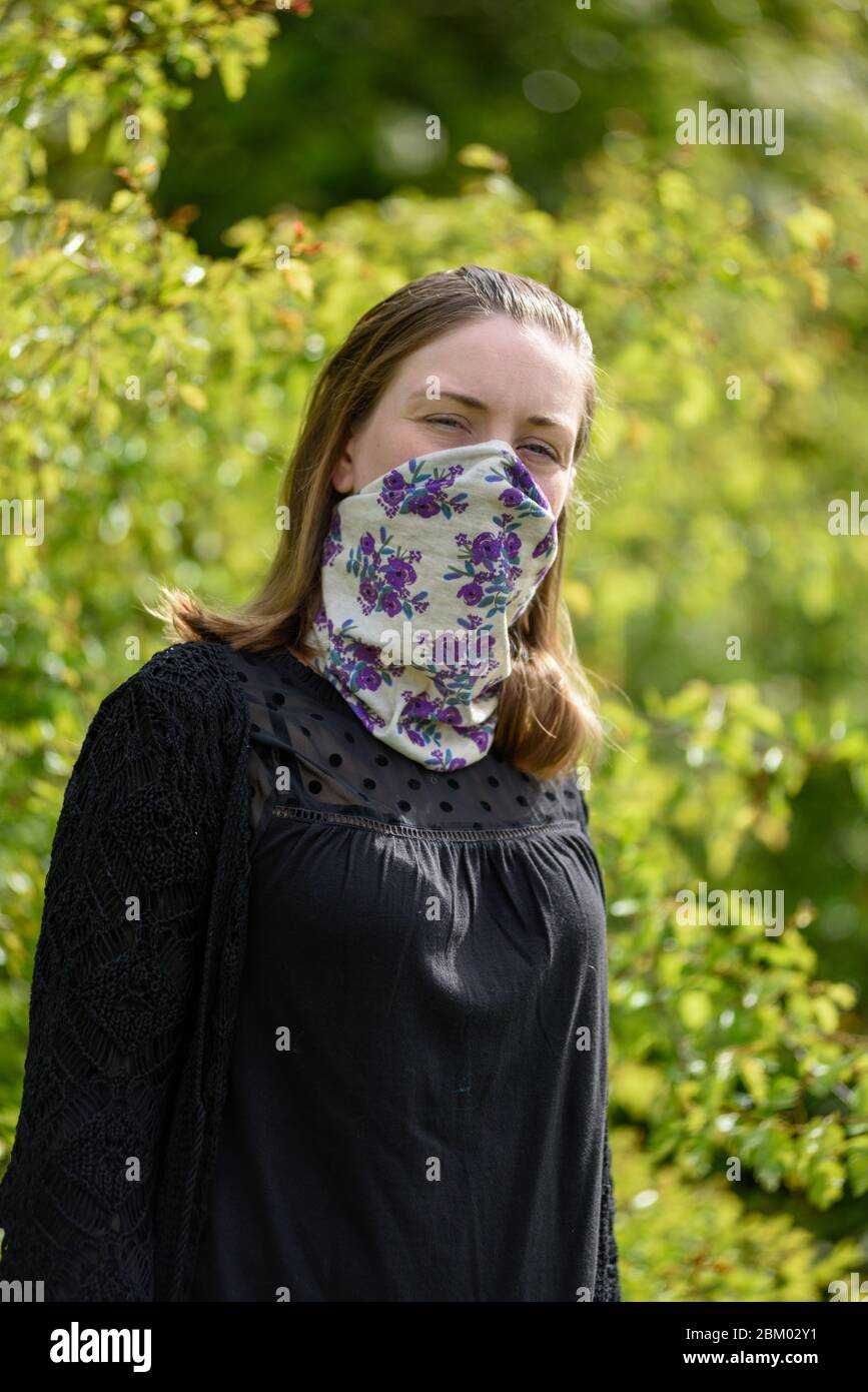 Young women wearing home made face mask. Stock Photo