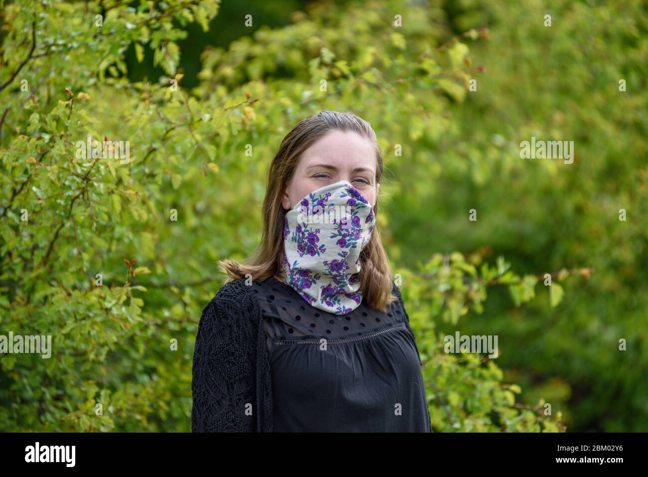 Young women wearing homemade face mask. Stock Photo