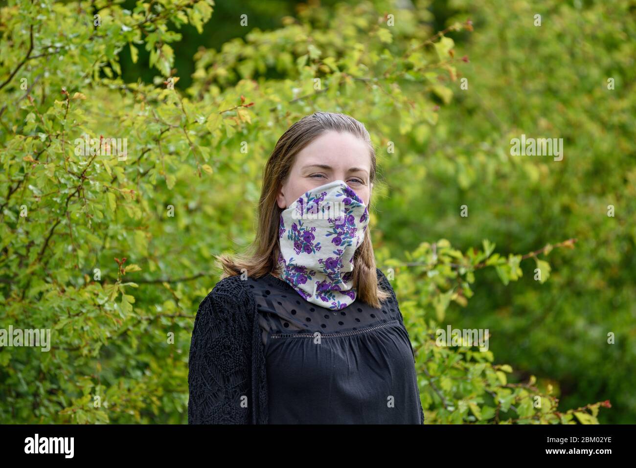 Young women wearing homemade face mask. Stock Photo