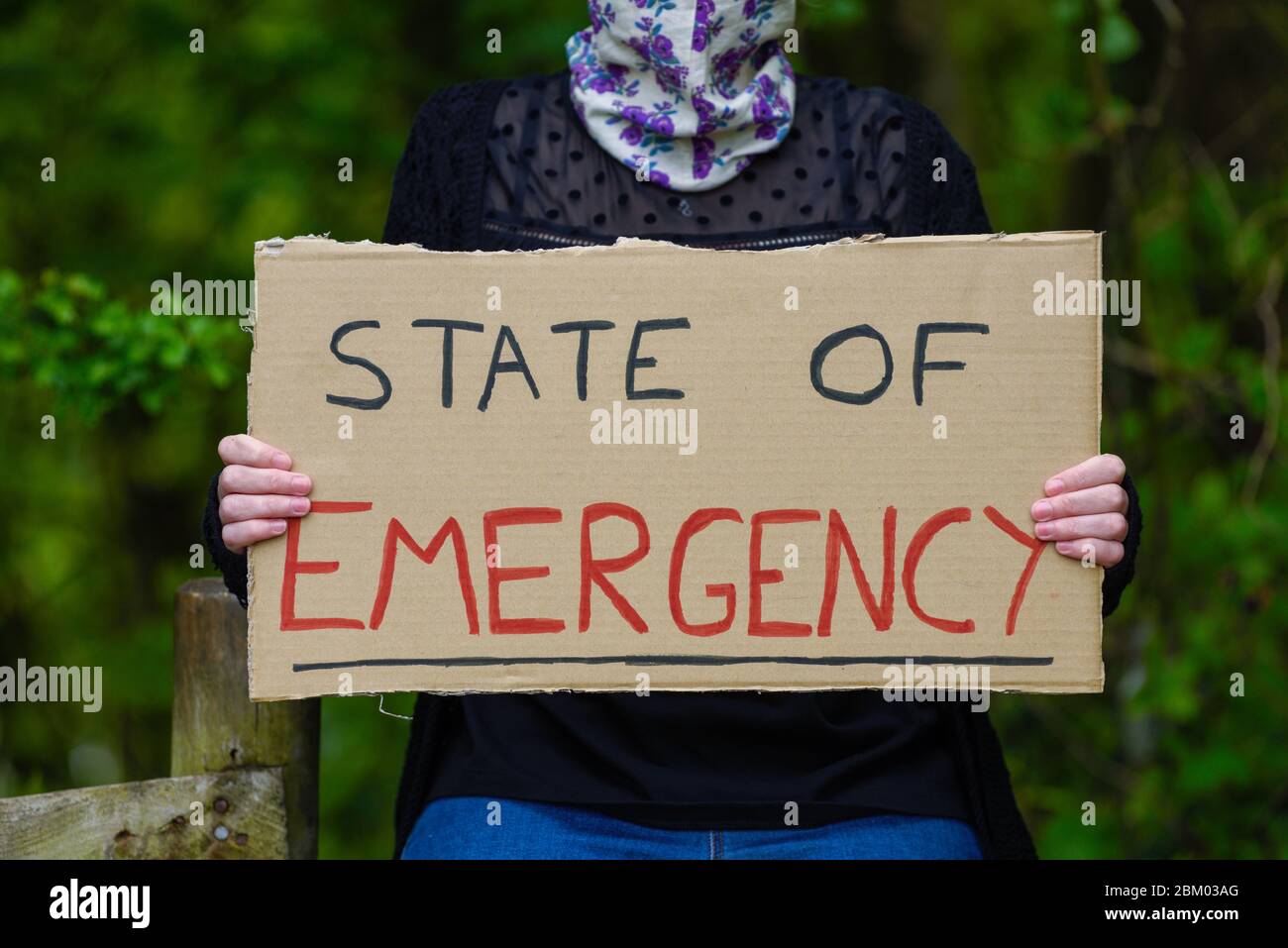 State of Emergency cardboard sign placard coronavirus pandemic. Stock Photo