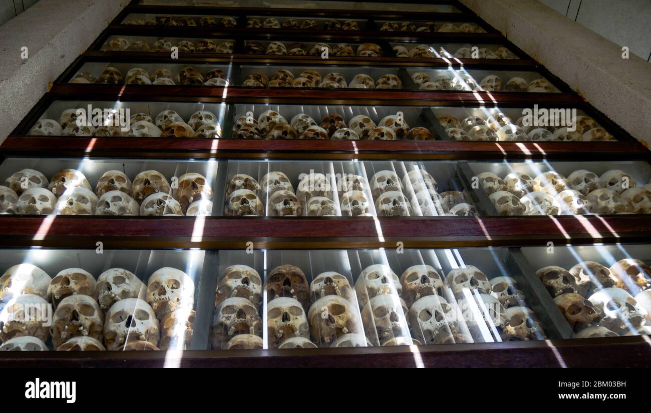 Skulls of the victims of the Khmer Rouge are exposed in the Cheoeung Ek death camp (Phnom Penh- Cambodia) Stock Photo