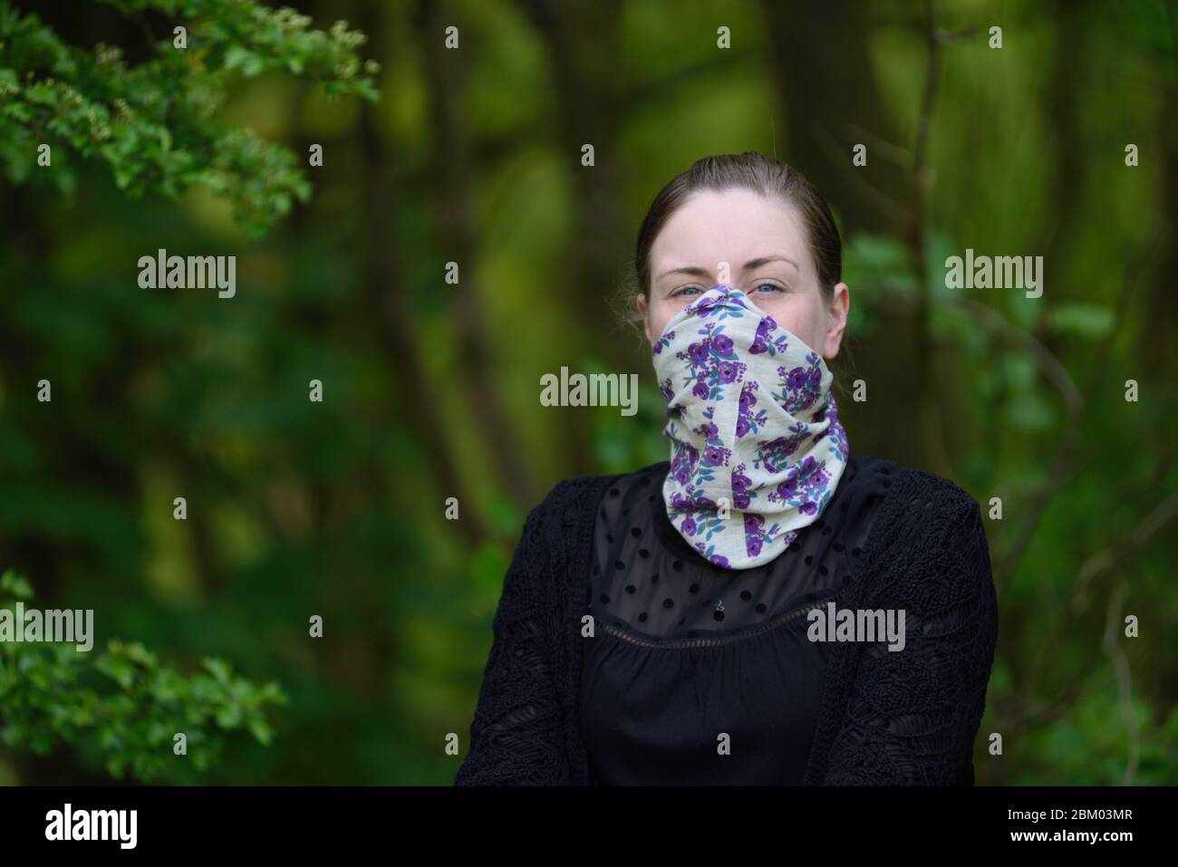 Young women wearing a homemade face mask. Stock Photo