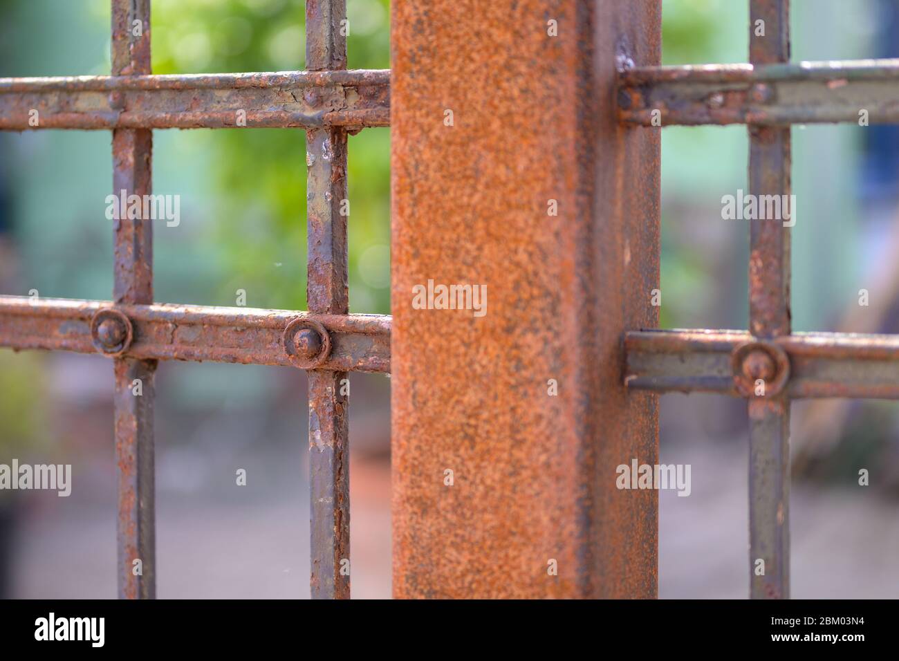 View on an iron railing of a courtyard in spring sunshine Stock Photo ...