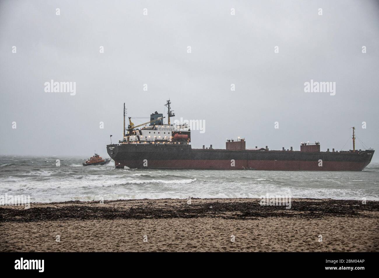 Falmouth Cornwall ,The ill-fated Russian bulk carrier Kuzma Minin, since renamed Energy Annabelle, is leaving Falmouth port this week Russian Cargo ship runs aground on Gyllyngvase beach Falmouth Cornwall, UK. 18th Dec, 2018. with the falmouth lifeboat, The ill-fated Russian bulk carrier Kuzma Minin, since renamed Energy Annabelle, is leaving Falmouth port this week for a shipbreaker's in Sea Diamond. It has spent 15 months moored to the Cross Roads casualty reception buoy. On December 18, 2018, the bulk carrier dragged anchor in gale force winds and went ashore west of Gyllyngvase Stock Photo