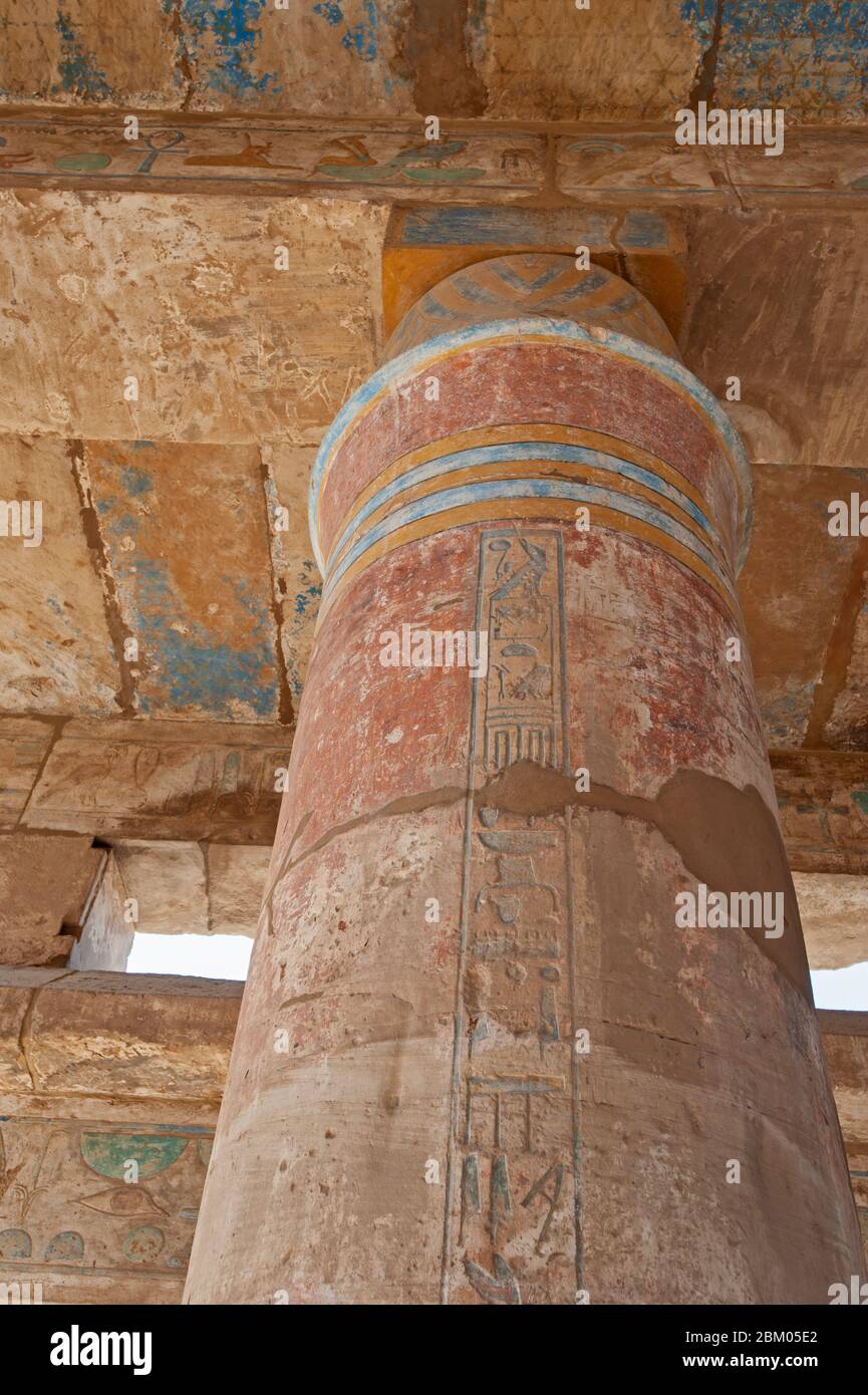 Hieroglypic carvings and paintings on columns at the ancient egyptian Karnak temple in Luxor Stock Photo
