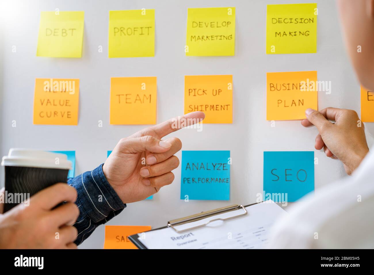 Business Development Sticky Notes young business workers posting with sticky notes stickers reminders ...