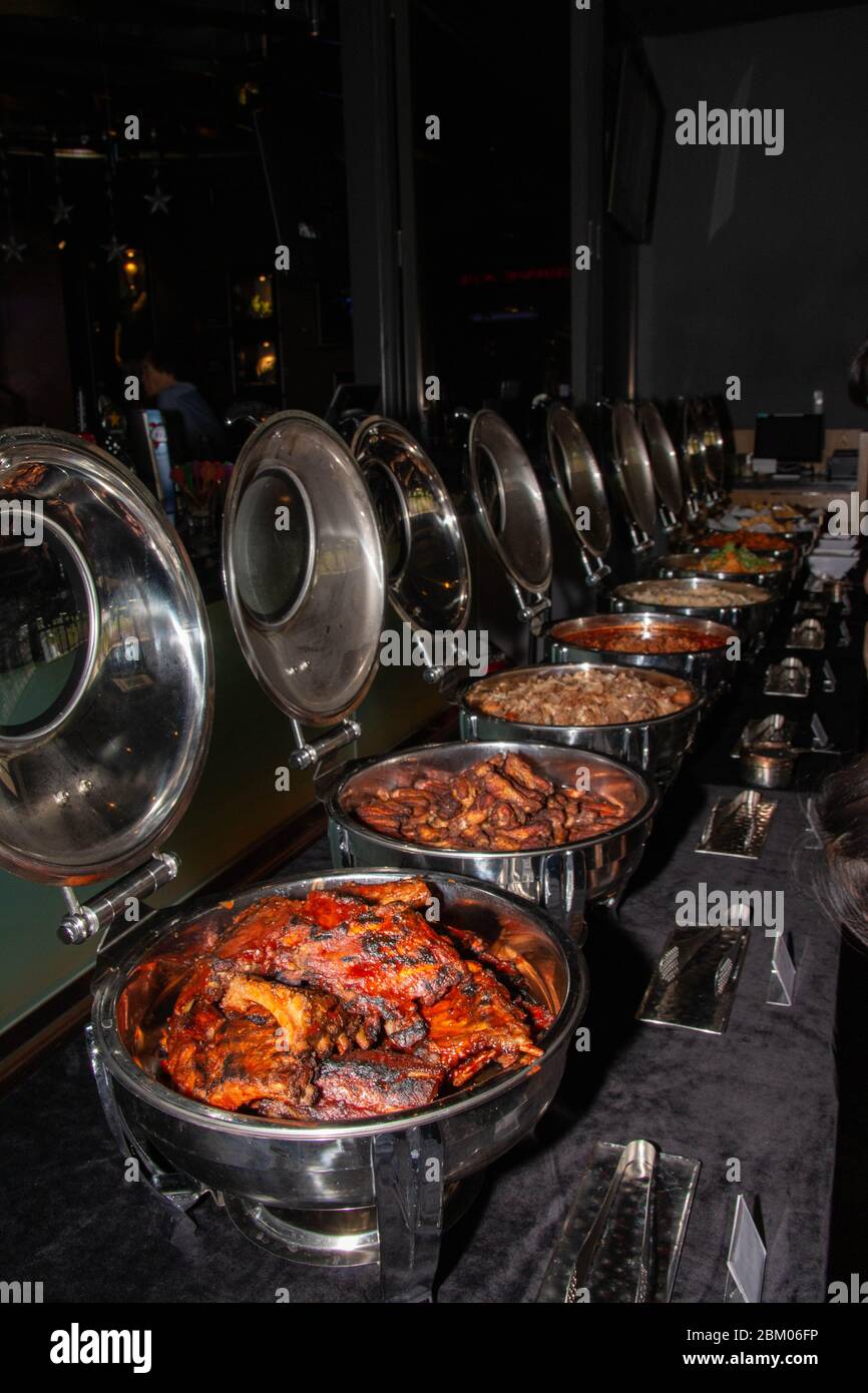 Buffet trays with spicy meat food inside a restaurant Stock Photo Alamy