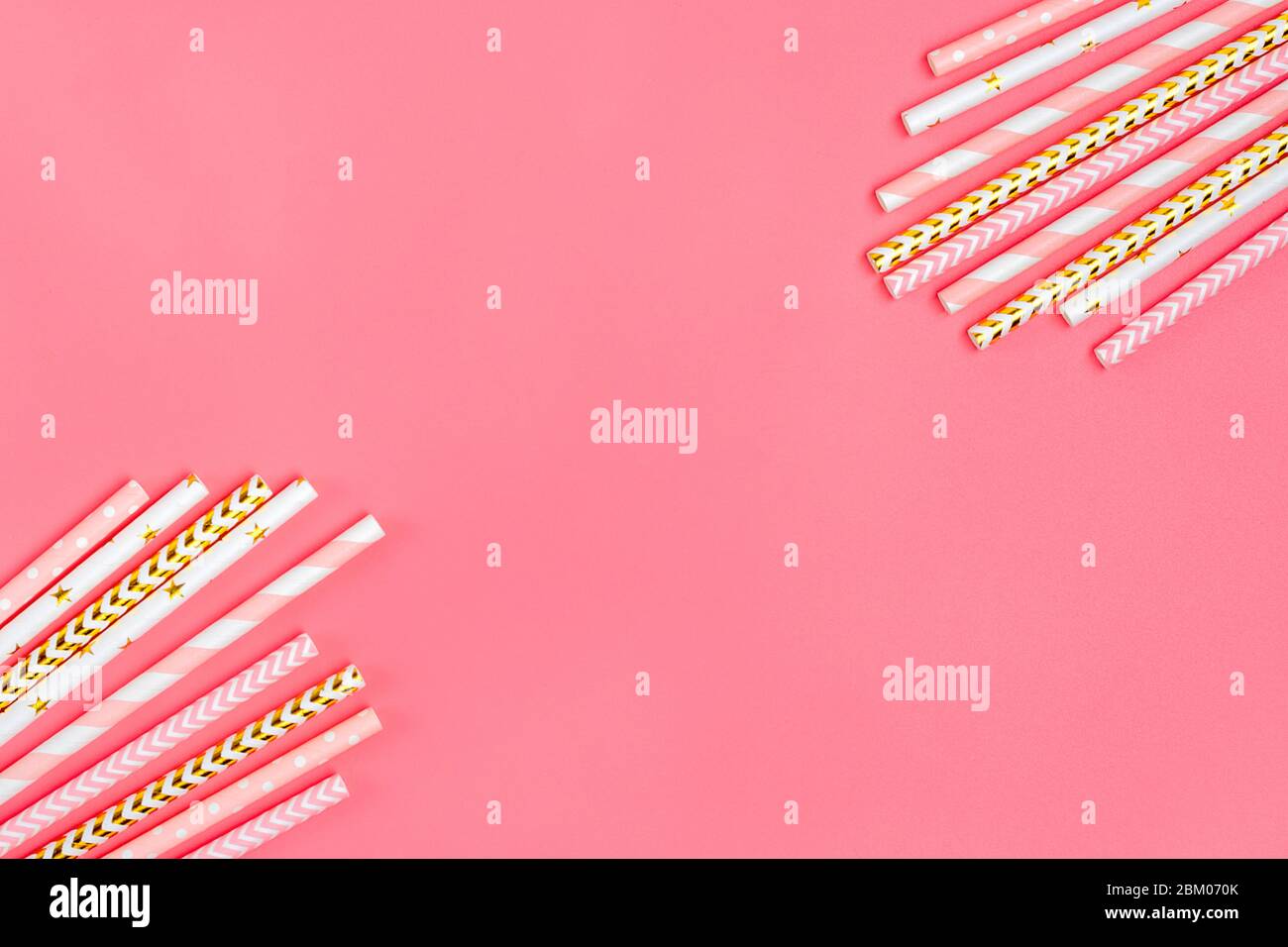 Drinking paper straws for party with golden, white, pink stripes on