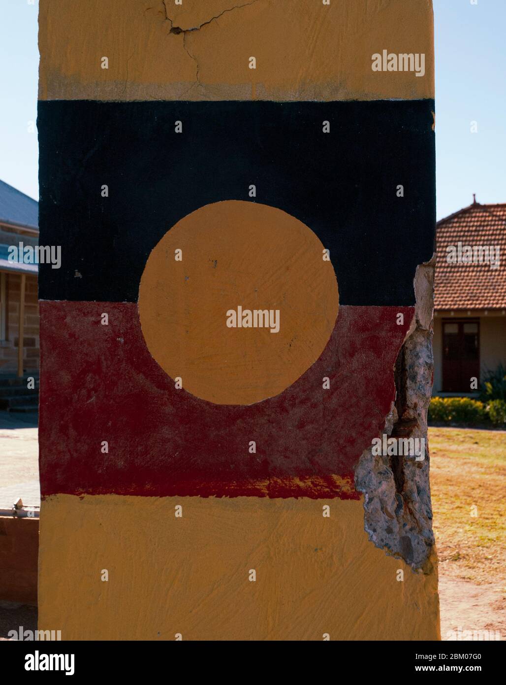 Australian Aboriginal flag painted on a pillar Cockatoo Island Stock Photo