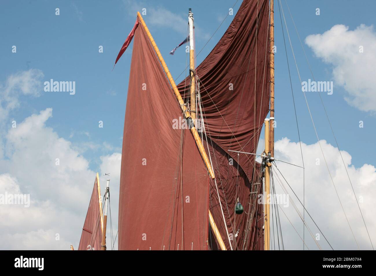 Lug sail and spritsail: lugger 'Ocean Pearl' and Thames barge 'Alice' waiting for the wind to start a race in the Yarmouth Old Gaffers' Festival, IOW Stock Photo