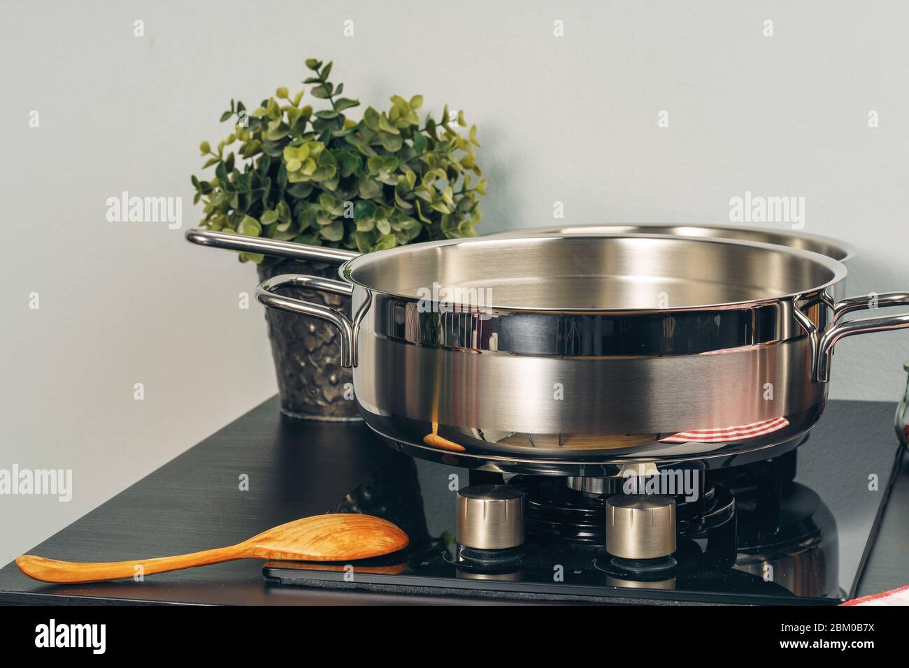 Frying pan on the gas stove in a kitchen Stock Photo