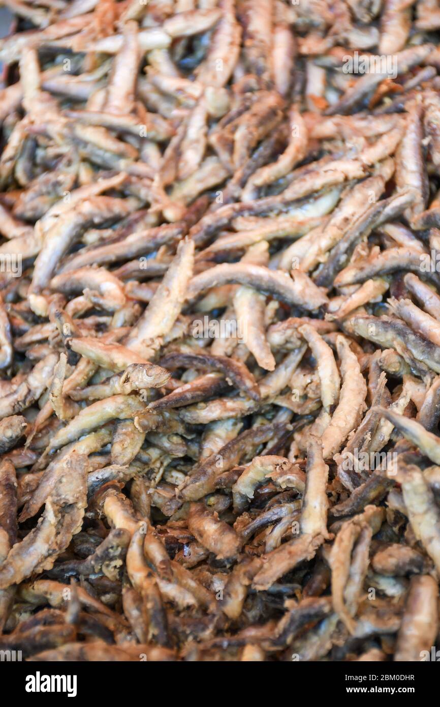 Fresh seafood anchovies sardines mix cooking steaming large wok pan