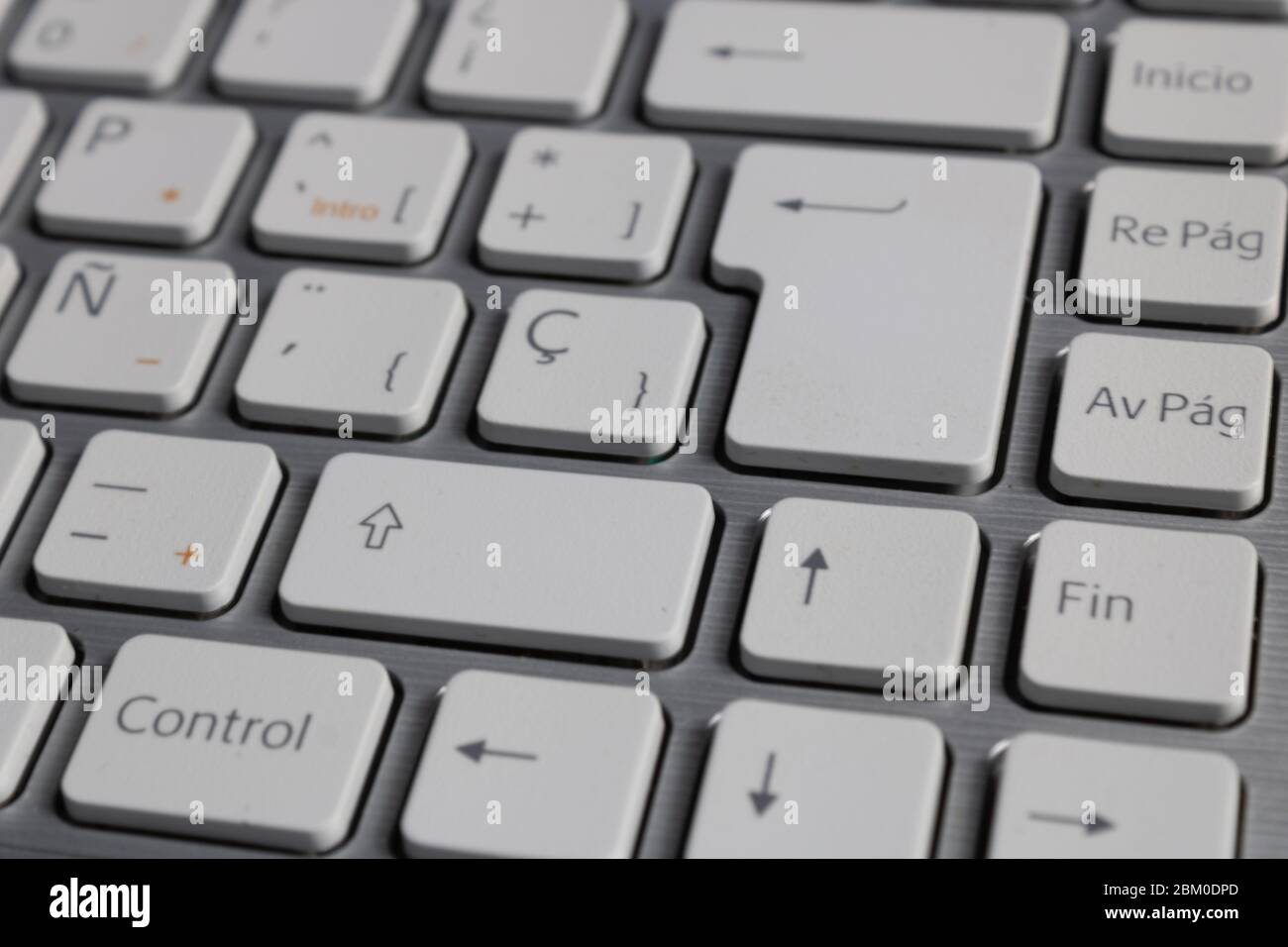grey laptop with white keyboard Stock Photo