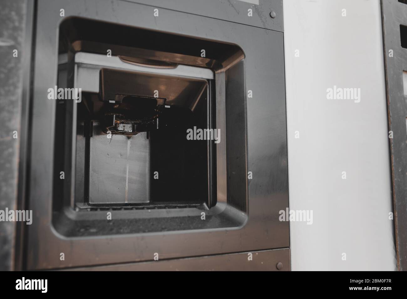 Dirty coffee machine close up look. Barista equipment. Coffee maker