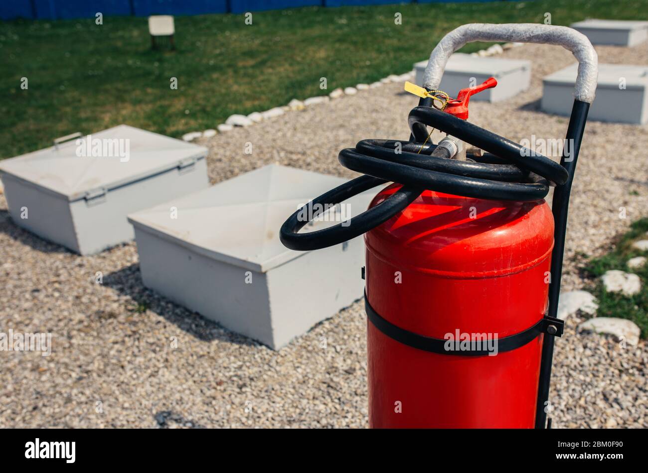 Fire closeup extinguishers available in fire emergencies at a petrol