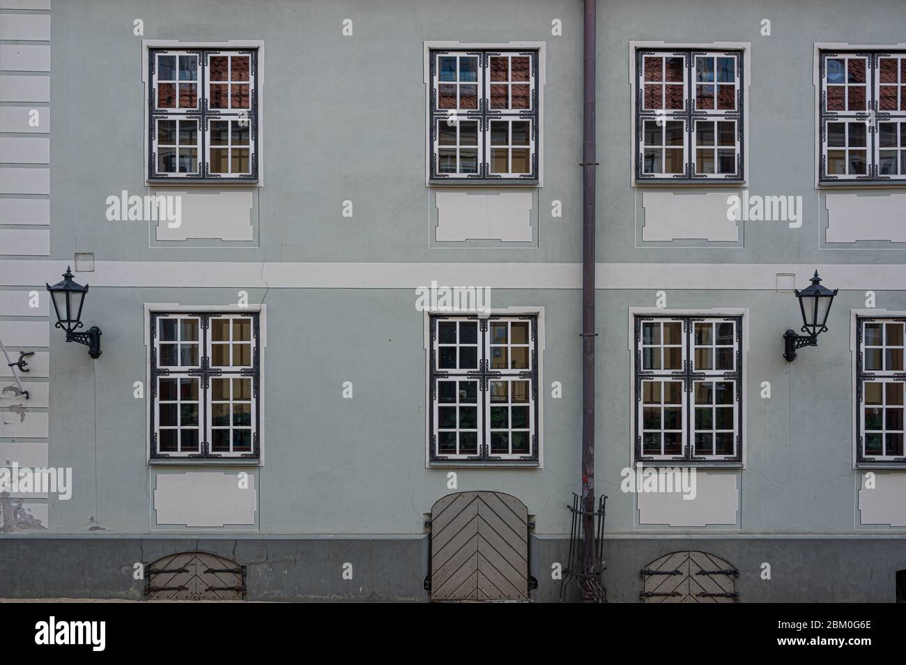 Facade with windows of light blue historic building Stock Photo - Alamy