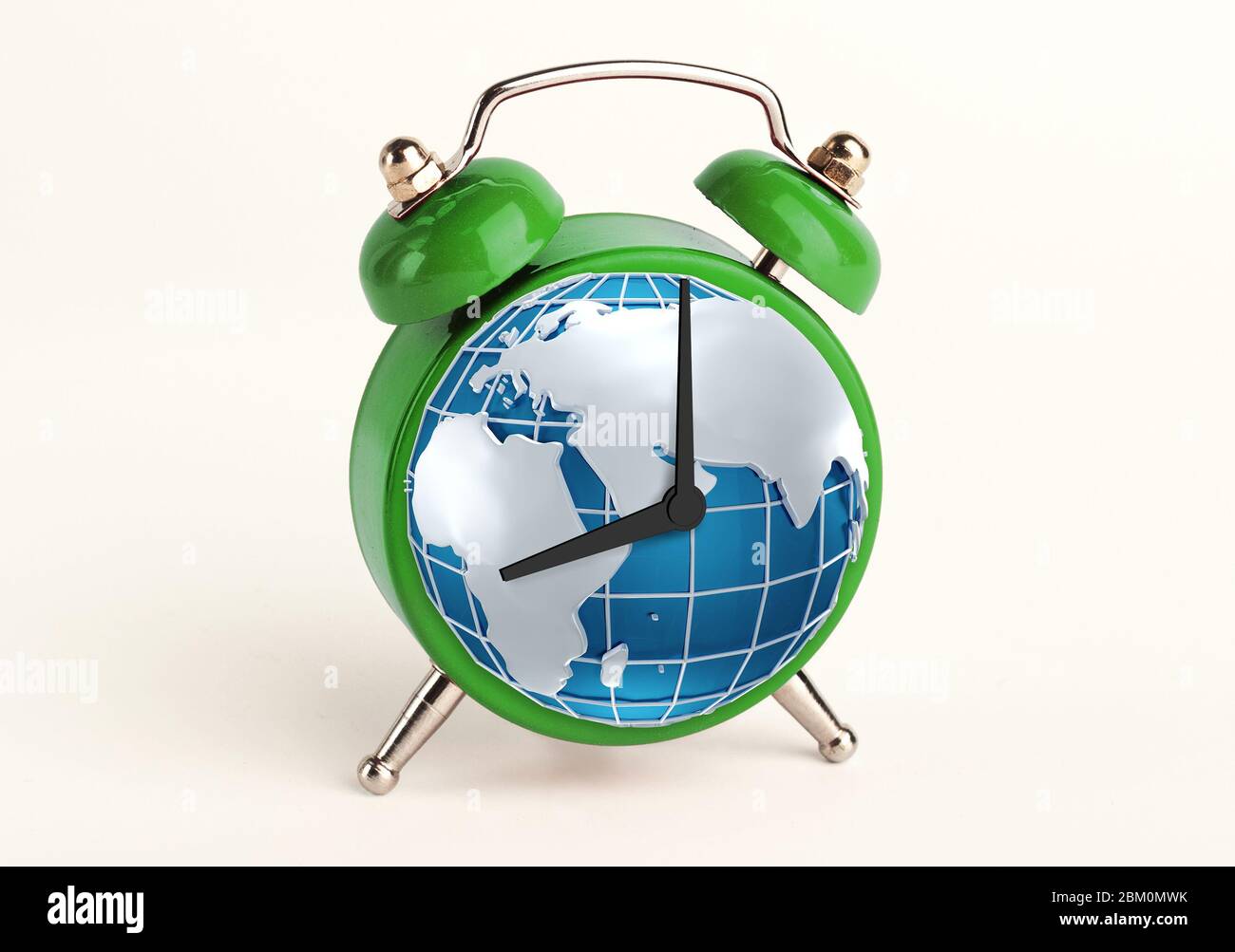 Environmental wakeup call. Collage of alarm clock with globe instead of hour face isolated on white Stock Photo