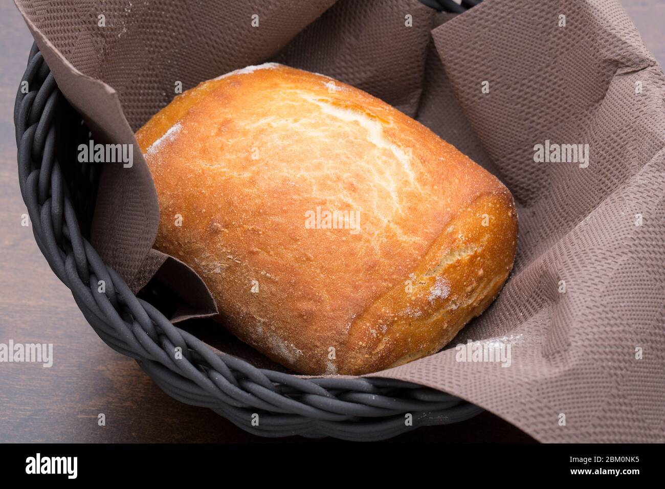 One bagel in a basket Stock Photo