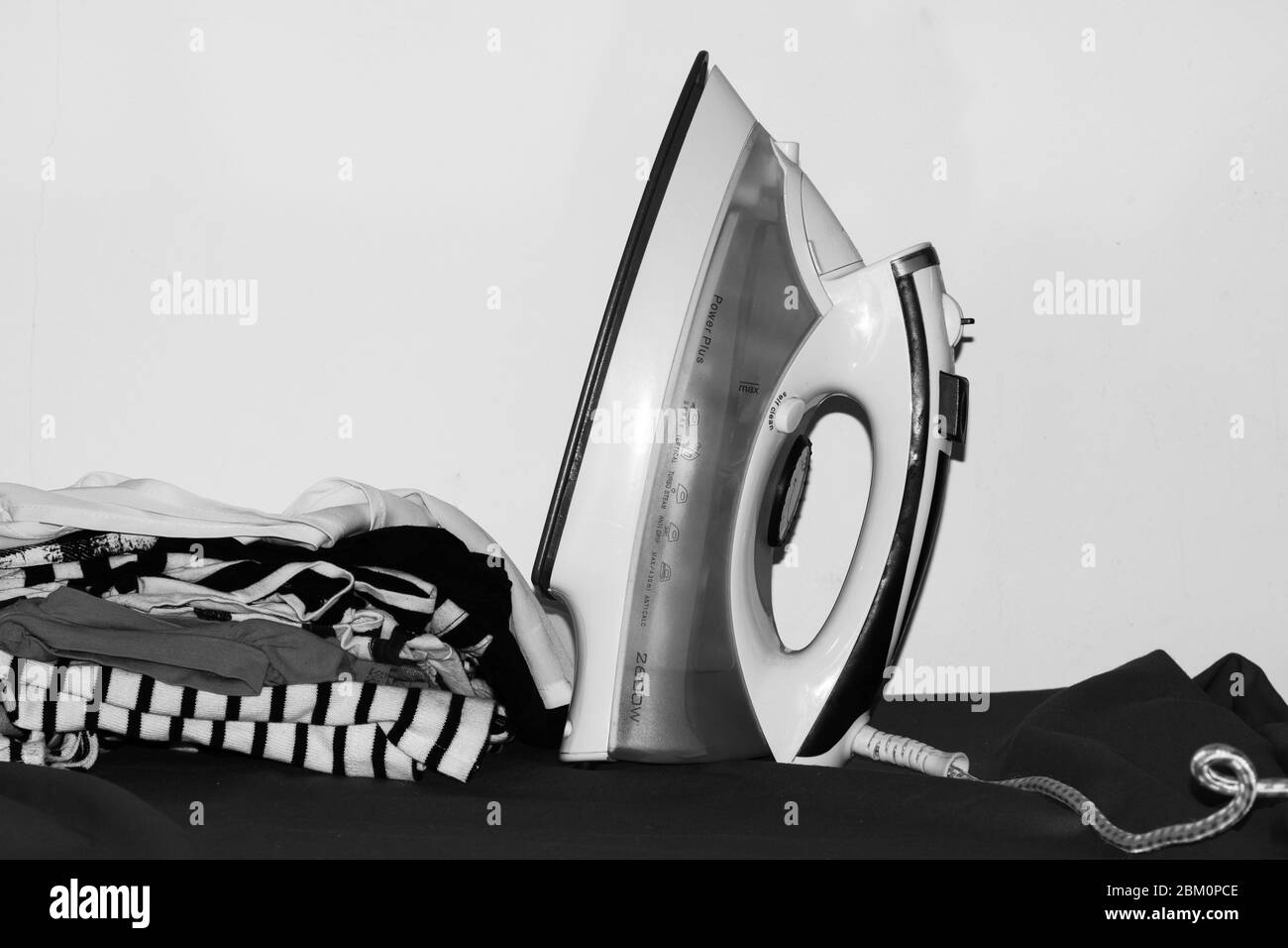 Ironing clothes Black and White Stock Photos & Images - Alamy