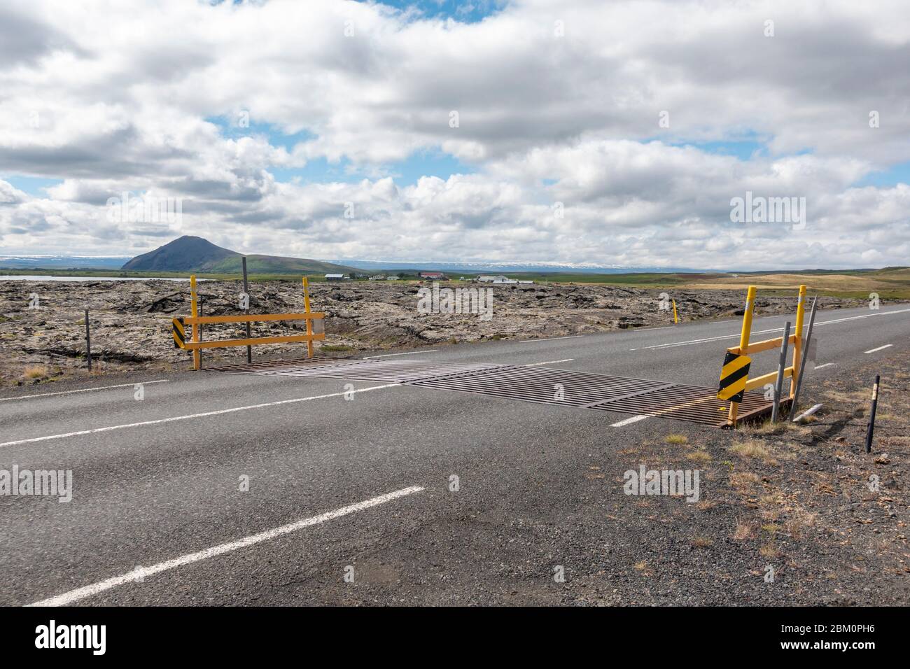 Cattle grid (for deer) on the Ring Road (Route 1) Krafla lava fields close to Reykjahlíð, Myvatn, Iceland. Stock Photo
