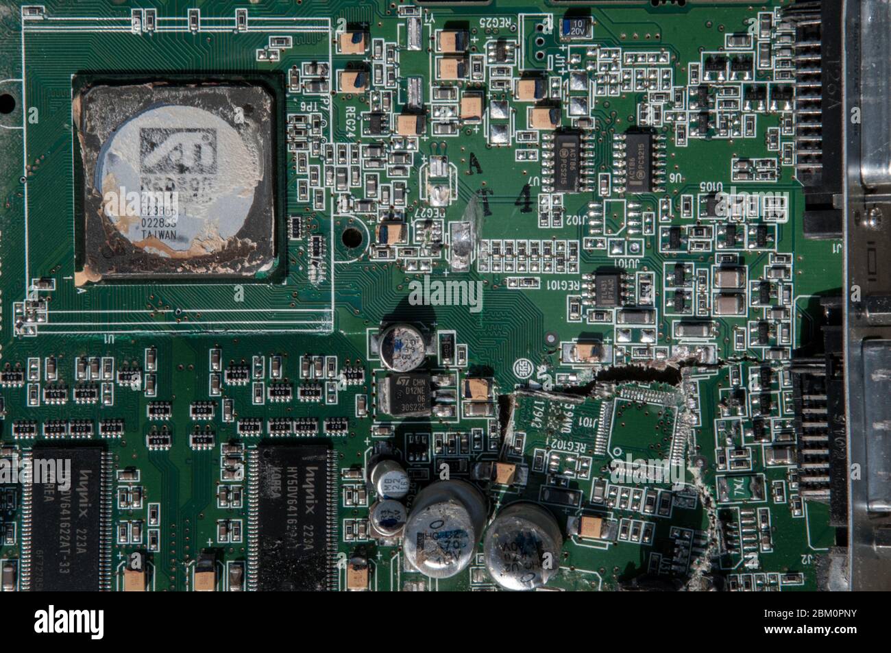 Smashed and broken computer circuit board. Stock Photo