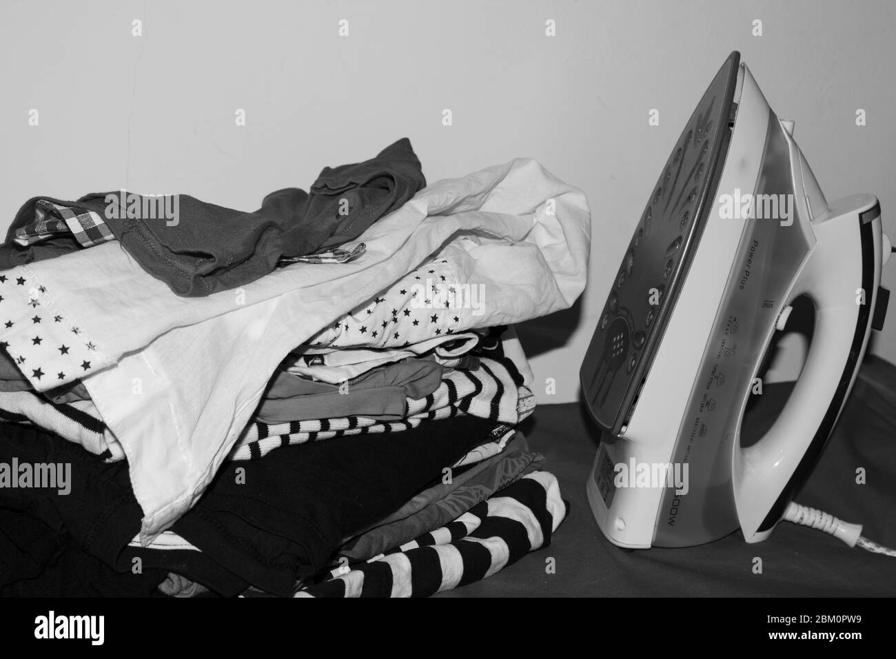 Ironing clothes Black and White Stock Photos & Images - Alamy