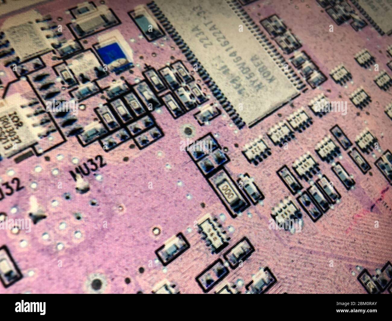 Closeup details of computer circuit board with experimental treatment ...