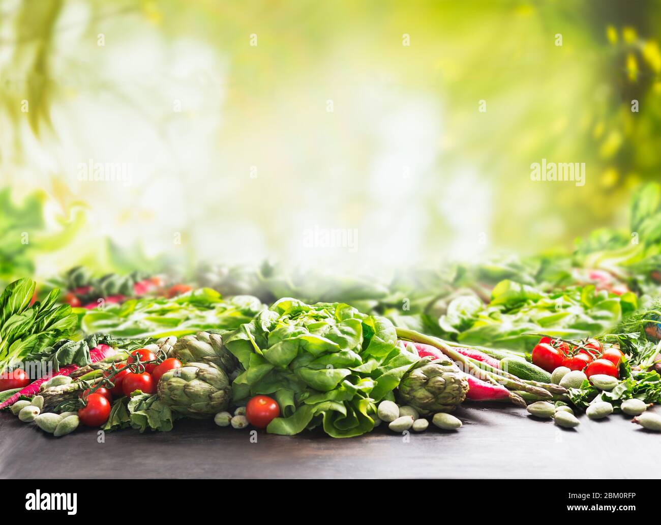 Clean organic farm vegetables background at sunny summer garden green  nature background. Eco veggies . Healthy food concept. Tomato, lettuce,  root Stock Photo - Alamy