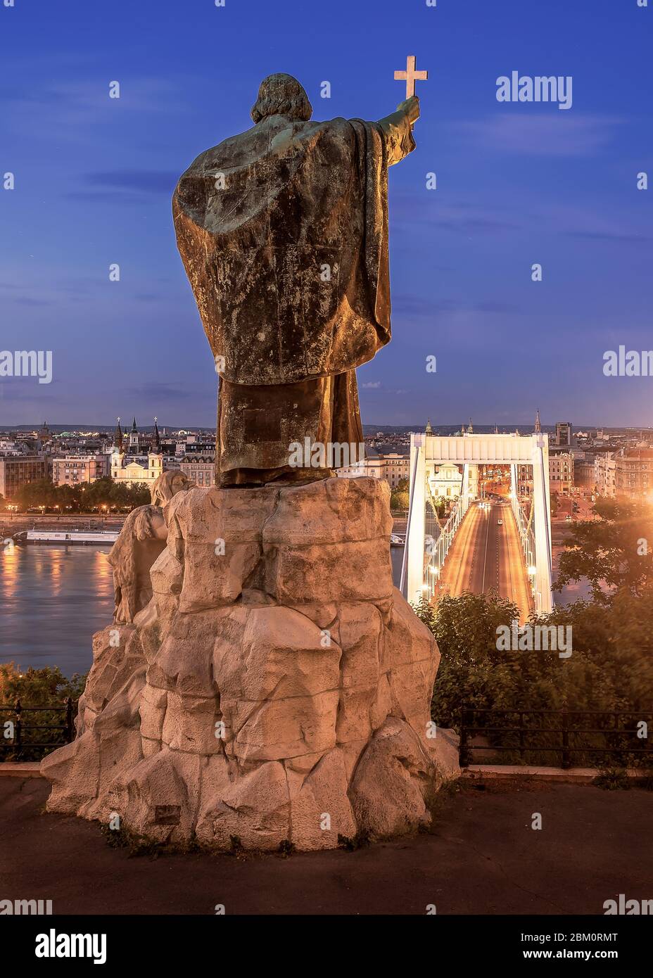 Hungary Budapest. Saint Gellert bishop monument. Erzsebet bridge on the backjground. This statue  has on the Gellert hill side. Fantastic panoramic vi Stock Photo